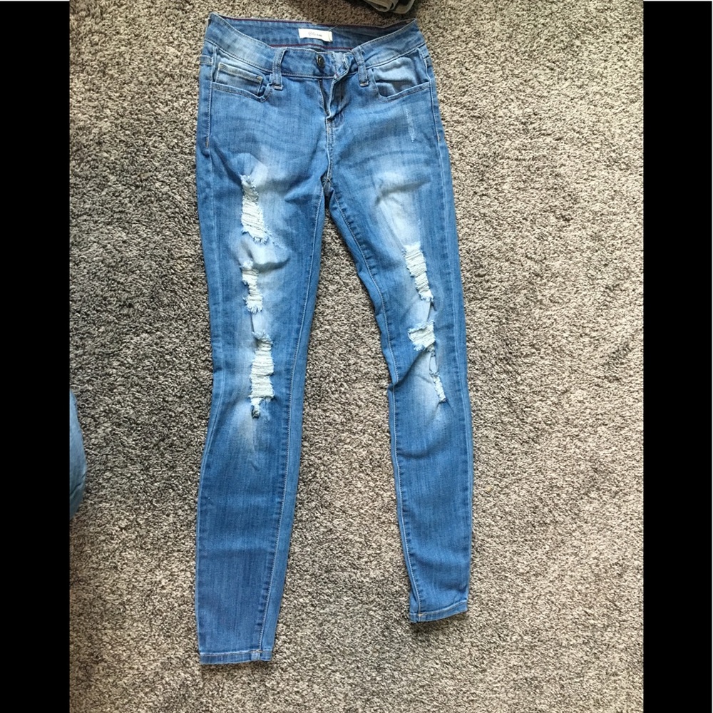 Distressed denim jeans